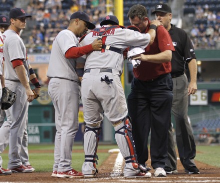 Molina staggers after being mowed down by Josh Harrison in a violent home plate collision