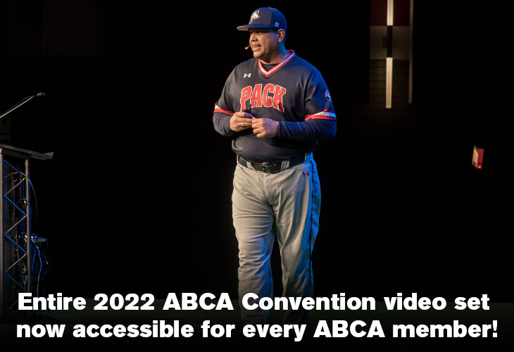 CSU Pueblo head coach Bobby Applegate presenting on stage in black uniform top with grey pants at 2022 ABCA Convention