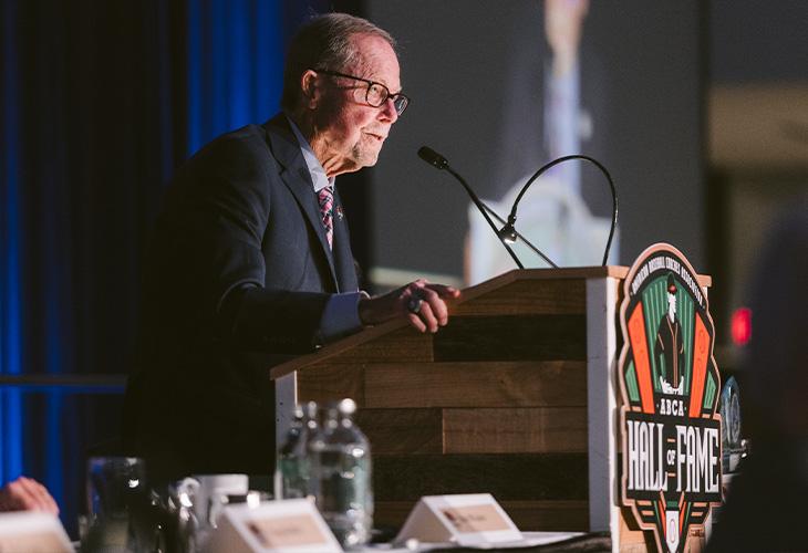 Pat Doyle speaking at podium after receiving award.